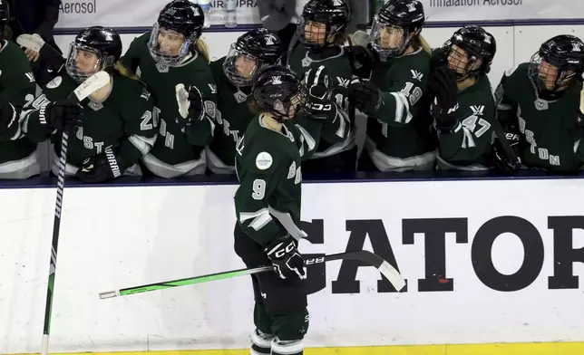 Boston forward Sophie Shirley (9) is congratulated for a goal against Montreal during the third period of a PWHL playoff hockey game Tuesday, May 14, 2024, in Lowell, Mass. (AP Photo/Mark Stockwell)