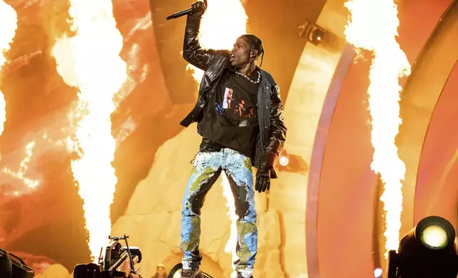 FILE - Travis Scott performs at the Astroworld Music Festival in Houston, Nov. 5, 2021. The start of the first civil trial stemming from the 2021 Astroworld festival, at which 10 people were killed in a crowd surge, has been delayed. Jury selection had been set to begin Tuesday, May 7, 2024, in the wrongful-death lawsuit filed the family of Madison Dubiski, a 23-year-old Houston resident who was killed during the crowd crush at Scott's November 2021 concert. (Photo by Amy Harris/Invision/AP, File)