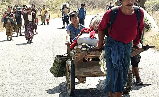 In this photo released by the Free Burma Rangers, people flee Myanmar military in Pasaung, Karenni state, Myanmar on March 1, 2024. (Free Burma Rangers via AP)