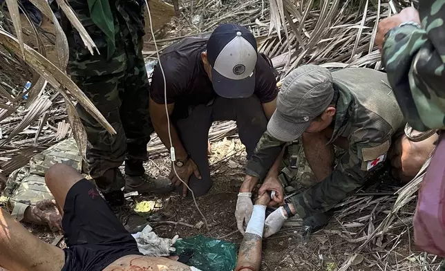 In this photo released by the Free Burma Rangers, a wounded person is treated in Karen state, Myanmar on April 24, 2024. (Free Burma Rangers via AP)