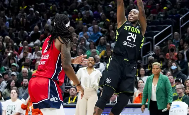 Seattle Storm guard Jewell Loyd shoots against Washington Mystics forward Myisha Hines-Allen during the first half of a WNBA basketball game Saturday, May 25, 2024, in Seattle. (AP Photo/Lindsey Wasson)