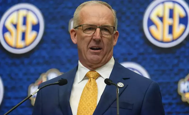 FILE - Southeastern Conference Commissioner Greg Sankey speaks during SEC football media days, July 18, 2022, in Atlanta. The NCAA and the nation's five biggest conferences have agreed to pay nearly $2.8 billion to settle a host of antitrust claims,a monumental decision that sets the stage for a groundbreaking revenue-sharing model that could start directing millions of dollars directly to athletes as soon as the 2025 fall semester. (AP Photo/John Bazemore, File)