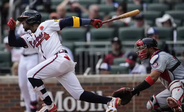 Atlanta Braves second baseman Ozzie Albies (1) hits a single against the Washington Nationals in the first inning of a baseball game, Monday, May 27, 2024, in Atlanta. (AP Photo/Mike Stewart)
