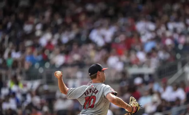 Washington Nationals pitcher Mitchell Parker (70) works in the third inning of a baseball game against the Atlanta Braves, Monday, May 27, 2024, in Atlanta. (AP Photo/Mike Stewart)