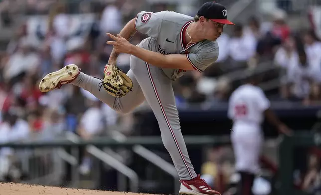 Washington Nationals pitcher Mitchell Parker (70) delivers in the first inning of a baseball game against the Atlanta Braves, Monday, May 27, 2024, in Atlanta. (AP Photo/Mike Stewart)