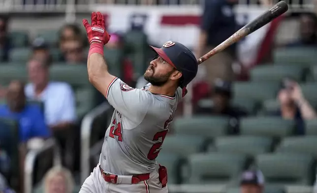 Washington Nationals first baseman Joey Gallo (24) hits a single in the eighth inning of a baseball game against the Atlanta Braves, Monday, May 27, 2024, in Atlanta. (AP Photo/Mike Stewart)