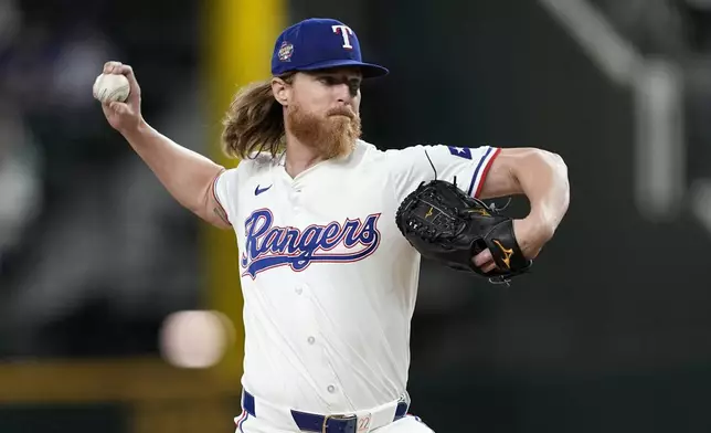 Texas Rangers starting pitcher Jon Gray throws to the Washington Nationals in the first inning of a baseball game in Arlington, Texas, Tuesday, April 30, 2024. (AP Photo/Tony Gutierrez)