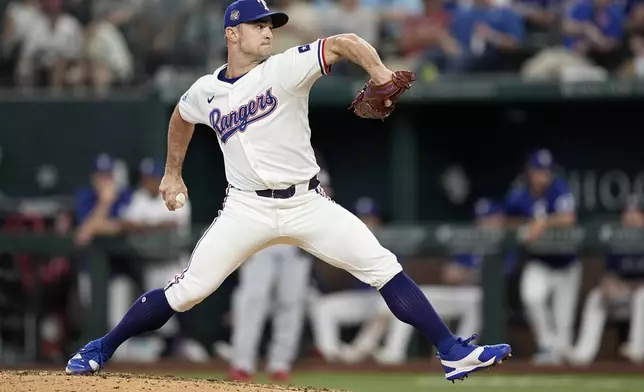 Texas Rangers relief pitcher David Robertson throws to the Washington Nationals in the eighth inning of a baseball game in Arlington, Texas, Thursday, May 2, 2024. (AP Photo/Tony Gutierrez)
