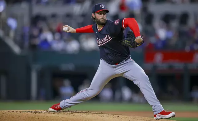 Washington Nationals starting pitcher Trevor Williams delivers during the first inning of a baseball game against the Texas Rangers in Arlington, Texas, Wednesday, May 1, 2024. (AP Photo/Gareth Patterson)