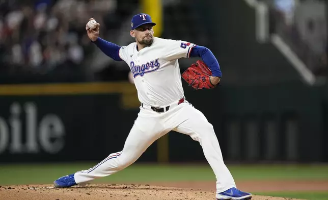 Texas Rangers starting pitcher Nathan Eovaldi throws to the Washington Nationals in the second inning of a baseball game in Arlington, Texas, Thursday, May 2, 2024. (AP Photo/Tony Gutierrez)
