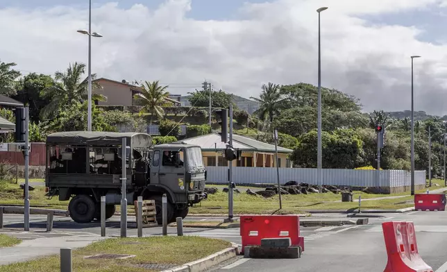 French gendarmes patrol the streets in Noumea, New Caledonia, Thursday May, 16, 2024. France has imposed a state of emergency in the French Pacific territory of New Caledonia. The measures imposed on Wednesday for at least 12 days boost security forces' powers to quell deadly unrest that has left four people dead, erupting after protests over voting reforms. (AP Photo/Cedric Jacquot)