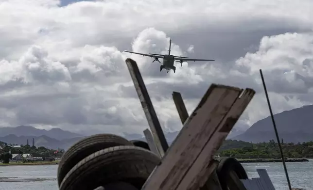 A French military plane arrives at Noumea-Magenta airport, New Caledonia, Thursday May, 16, 2024. France has imposed a state of emergency in the French Pacific territory of New Caledonia. The measures imposed on Wednesday for at least 12 days boost security forces' powers to quell deadly unrest that has left four people dead, erupting after protests over voting reforms. (AP Photo/Cedric Jacquot)