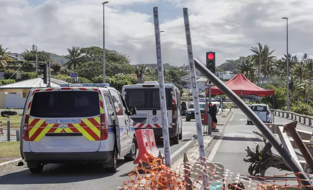 Municipal police vana patrol the streets in Noumea, New Caledonia, Thursday May, 16, 2024. France has imposed a state of emergency in the French Pacific territory of New Caledonia. The measures imposed on Wednesday for at least 12 days boost security forces' powers to quell deadly unrest that has left four people dead, erupting after protests over voting reforms. (AP Photo/Cedric Jacquot)