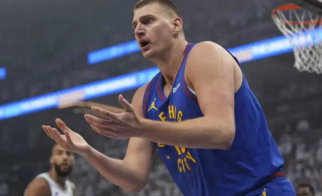 Denver Nuggets center Nikola Jokic reacts toward a referee during the first half of Game 6 of the team's NBA basketball second-round playoff series against the Minnesota Timberwolves, Thursday, May 16, 2024, in Minneapolis. (AP Photo/Abbie Parr)
