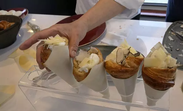 Twisted croissants with artichoke puree, a poached egg, a bit of truffle, and a bit of cheese, created by French chef Amandine Chaignot, are seen Tuesday, April 30, 2024 in Paris. Some 40,000 meals will be served each day during the Games to over 15,000 athletes housed at the Olympic village. (AP Photo/Michel Euler)