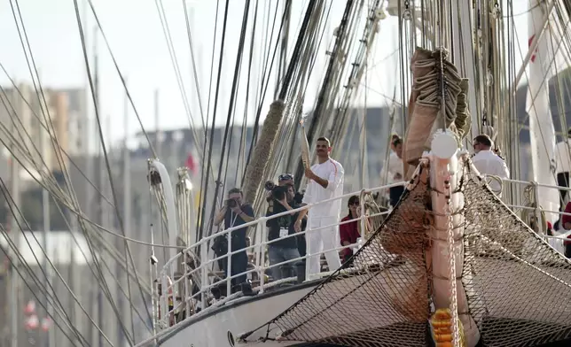 First torch bearer carrier in France French Olympic swimmer Florent Manaudou holds the Olympic torch aboard The Belem, the three-masted sailing ship in the Old port of Marseille, southern France, Wednesday, May 8, 2024. After leaving Marseille, a vast relay route is undertaken before the torch odyssey ends on July 27 in Paris. The Paris 2024 Olympic Games will run from July 26 to Aug.11, 2024. (AP Photo/Thibault Camus)