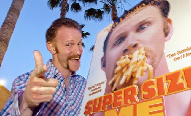 FILE - Morgan Spurlock poses at the Los Angeles premiere of his film "Super Size Me," Thursday night, April 22, 2004, in the Hollywood section of Los Angeles. Spurlock, an Oscar-nominee who made food and American diets his life’s work, famously eating only at McDonald’s for a month to illustrate the dangers of a fast-food diet, has died. He was 53. (AP Photo/Mark J. Terrill)