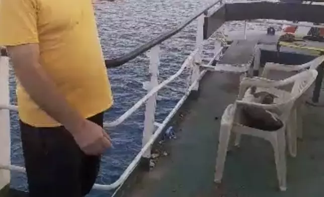 This image from video provided by Abdul Nasser Saleh shows him on the deck of the cargo ship Al-Maha, abandoned by its owners, at the seaport of Jeddah, Saudi Arabia, in January 2024. Saleh, who was originally from Syria, said he had once been proud of his work as an engineer on the Al-Maha, which made its money ferrying livestock for Ramadan festivities between Sudanese and Saudi Arabian ports. (Courtesy Abdul Nasser Saleh via AP)