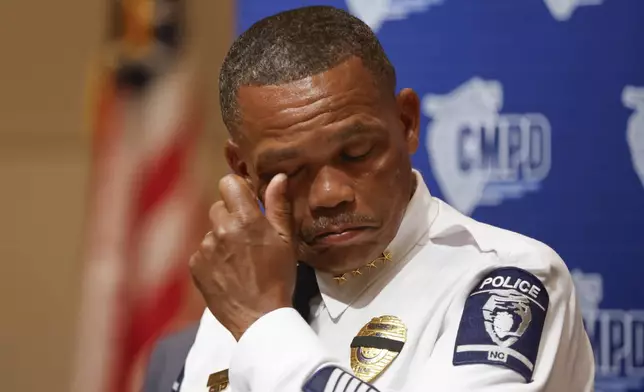 Charlotte-Mecklenburg Police Chief Johnny Jennings wipes away tears as he speaks at a press conference in Charlotte, N.C., Tuesday, April 30, 2024, regarding the shooting that killed four officers during an attempt to serve a warrant on April 29. (AP Photo/Nell Redmond)