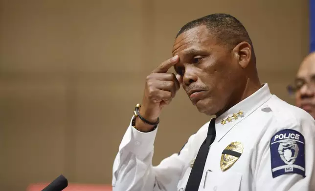 Charlotte-Mecklenburg Police Chief Johnny Jennings pauses to compose himself during a press conference in Charlotte, N.C., Tuesday, April 30, 2024, regarding a shooting that killed four officers during an attempt to serve a warrant on April 29. (AP Photo/Nell Redmond)
