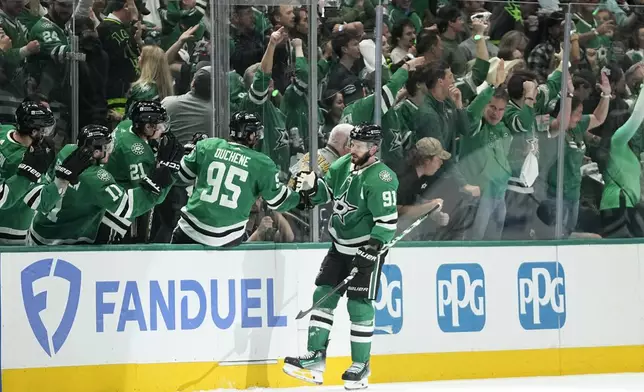 Dallas Stars center Tyler Seguin (91) is congratulated for a goal against the Edmonton Oilers during the second period of Game 1 of the Western Conference finals in the NHL hockey Stanley Cup playoffs Thursday, May 23, 2024, in Dallas. (AP Photo/Tony Gutierrez)