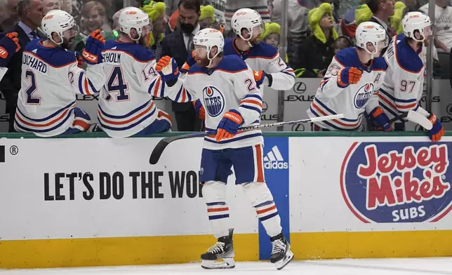 Edmonton Oilers right wing Connor Brown is congratulated for his goal against the Dallas Stars during the first period in Game 2 of the Western Conference finals in the NHL hockey Stanley Cup playoffs Saturday, May 25, 2024, in Dallas. (AP Photo/Tony Gutierrez)