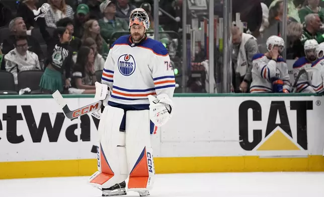 Edmonton Oilers goaltender Stuart Skinner skates back to the net after a media timeout during the first period in Game 2 of the Western Conference finals in the NHL hockey Stanley Cup playoffs against the Dallas Stars, Saturday, May 25, 2024, in Dallas. (AP Photo/Tony Gutierrez)