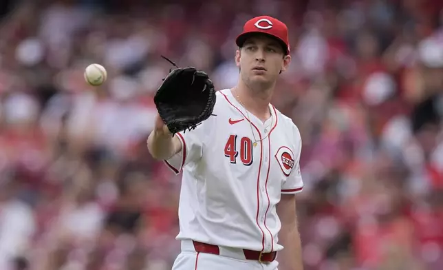 Cincinnati Reds starting pitcher Nick Lodolo catches a ball between batters in the first inning of a baseball game against the Baltimore Orioles, Sunday, May 5, 2024, in Cincinnati. (AP Photo/Carolyn Kaster)
