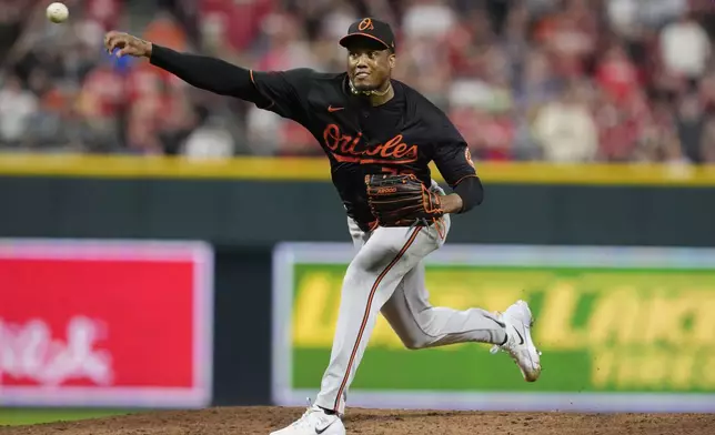 Baltimore Orioles pitcher Yennier Cano throws in the ninth inning of a baseball game against the Cincinnati Reds, Saturday, May 4, 2024, in Cincinnati. (AP Photo/Carolyn Kaster)