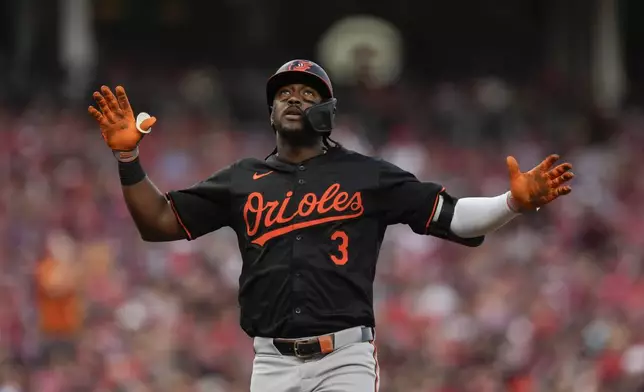 Baltimore Orioles' Jorge Mateo celebrates as he scores after hitting a home run in the fourth inning of a baseball game against the Cincinnati Reds, Saturday, May 4, 2024, in Cincinnati. The Orioles won 2-1. (AP Photo/Carolyn Kaster)