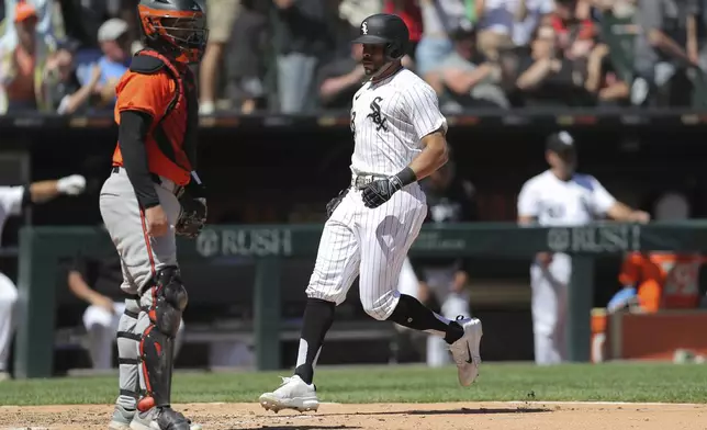 Chicago White Sox Tommy Pham scores on Gavin Sheets three-run RBI triple during the fifth inning of a baseball game against the Baltimore Orioles Saturday, May 25, 2024, in Chicago. (AP Photo/Melissa Tamez)