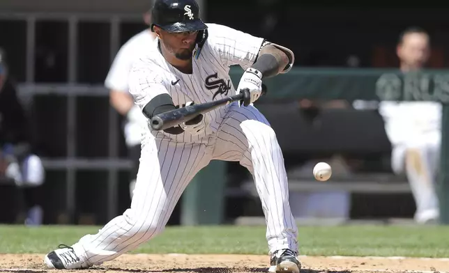 Chicago White Sox Martín Maldonado bunts during the fifth inning of a baseball game against the Baltimore Orioles Saturday, May 25, 2024, in Chicago. (AP Photo/Melissa Tamez)