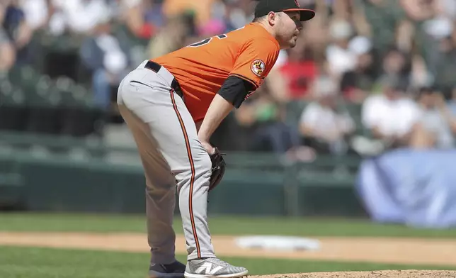 Baltimore Orioles Keegan Akin watches as Chicago White Sox Gavin Sheets hits a three-run RBI triple during the fifth inning of a baseball game against the Chicago White Sox Saturday, May 25, 2024, in Chicago. (AP Photo/Melissa Tamez)