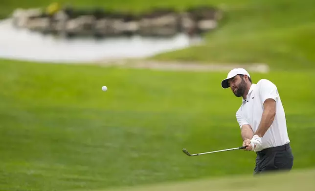 Scottie Scheffler chips to the green on the 18th hole during a practice round for the PGA Championship golf tournament at the Valhalla Golf Club, Wednesday, May 15, 2024, in Louisville, Ky. (AP Photo/Matt York)