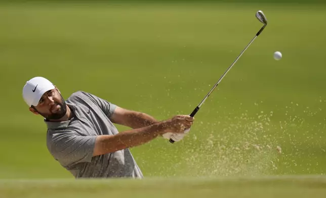 Scottie Scheffler hits from the bunker on the seventh hole during the third round of the PGA Championship golf tournament at the Valhalla Golf Club, Saturday, May 18, 2024, in Louisville, Ky. (AP Photo/Jeff Roberson)