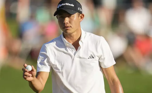 Collin Morikawa waves after making a putt on the 18th hole during the third round of the PGA Championship golf tournament at the Valhalla Golf Club, Saturday, May 18, 2024, in Louisville, Ky. (AP Photo/Sue Ogrocki)
