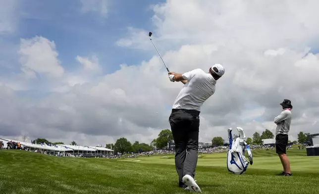 Scottie Scheffler hits from the rough on the 18th hole during a practice round for the PGA Championship golf tournament at the Valhalla Golf Club, Wednesday, May 15, 2024, in Louisville, Ky. (AP Photo/Matt York)