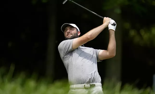 Scottie Scheffler watches his tee shot on the third hole during the third round of the PGA Championship golf tournament at the Valhalla Golf Club, Saturday, May 18, 2024, in Louisville, Ky. (AP Photo/Jeff Roberson)