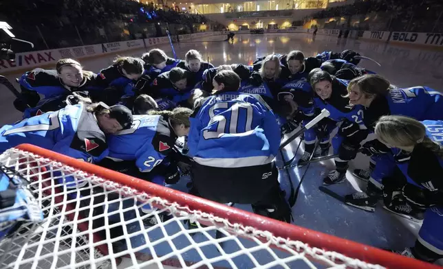Toronto players take part in a huddle for their last home game before the PWHL hockey playoffs start as they play Ottawa in Toronto, Sunday May 5, 2024. (Frank Gunn/The Canadian Press via AP)