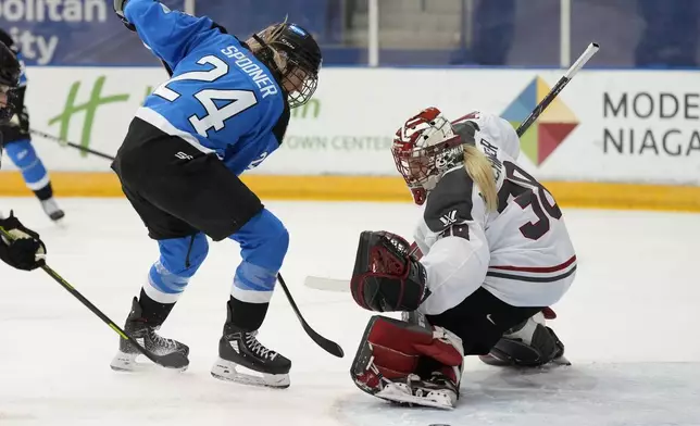 Ottawa goalie Emerance Maschmeyer, right, stops Toronto's Natalie Spooner (24) during second-period PWHL hockey game action in Toronto, Sunday, May 5, 2024. (Frank Gunn/The Canadian Press via AP)