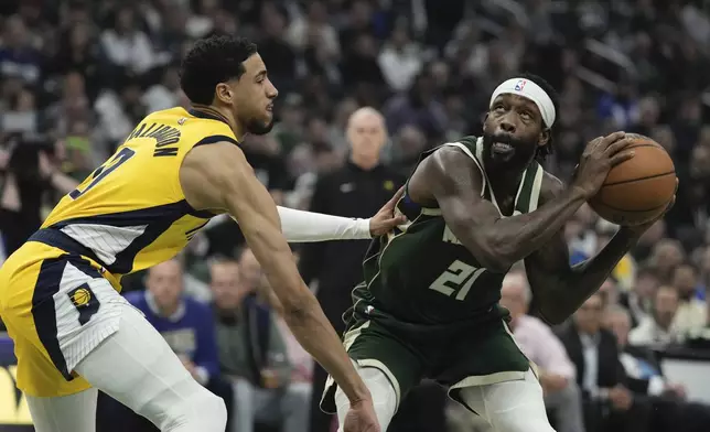 Milwaukee Bucks' Patrick Beverley tries to get past Indiana Pacers' Andrew Nembhard during the first half of Game 5 of the NBA playoff basketball series Tuesday, April 30, 2024, in Milwaukee. (AP Photo/Morry Gash)