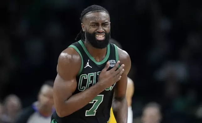 Boston Celtics guard Jaylen Brown (7) reacts on the court during the first half of Game 2 of the NBA Eastern Conference basketball finals against the Indiana Pacers, Thursday, May 23, 2024, in Boston. (AP Photo/Steven Senne)