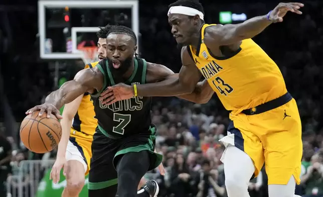 Boston Celtics guard Jaylen Brown (7) is defended by Indiana Pacers forward Pascal Siakam (43) during the second half of Game 2 of the NBA Eastern Conference basketball finals Thursday, May 23, 2024, in Boston. (AP Photo/Steven Senne)
