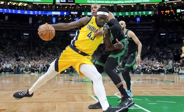 Indiana Pacers forward Pascal Siakam (43) is defended by Boston Celtics center Al Horford during the first half of Game 2 of the NBA Eastern Conference basketball finals Thursday, May 23, 2024, in Boston. (AP Photo/Steven Senne)