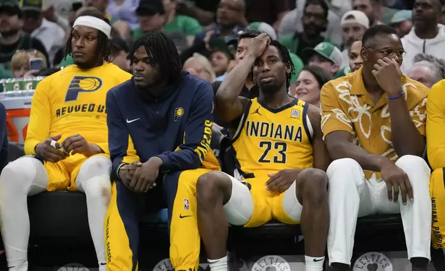 Members of the Indiana Pacers sit on the bench during the second half of Game 2 of the NBA Eastern Conference basketball finals against the Boston Celtics, Thursday, May 23, 2024, in Boston. (AP Photo/Steven Senne)