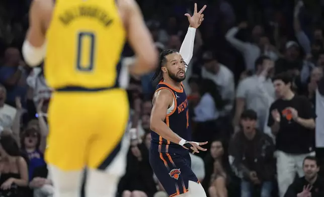 New York Knicks' Jalen Brunson (11) gestures after making a 3-point shot against the Indiana Pacers during the first half of Game 2 in an NBA basketball second-round playoff series Wednesday, May 8, 2024, in New York. (AP Photo/Frank Franklin II)