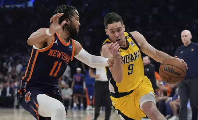 New York Knicks' Jalen Brunson (11) defends against Indiana Pacers' T.J. McConnell (9) during the first half of Game 2 in an NBA basketball second-round playoff series Wednesday, May 8, 2024, in New York. (AP Photo/Frank Franklin II)