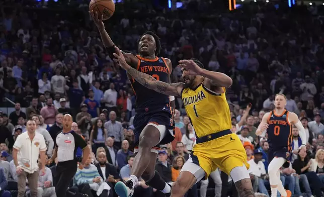 New York Knicks' OG Anunoby (8) drives past Indiana Pacers' Obi Toppin (1) during the second half of Game 2 in an NBA basketball second-round playoff series Wednesday, May 8, 2024, in New York. The Knicks won 130-121. (AP Photo/Frank Franklin II)