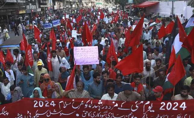 Members of National Trade Union Federation Pakistan take part in a May Day rally, marking International Labour Day in Karachi, Pakistan, Wednesday, May 1, 2024. Participants of the rally demand implementation of labor laws and increase in their wages. (AP Photo/Ikram Suri)