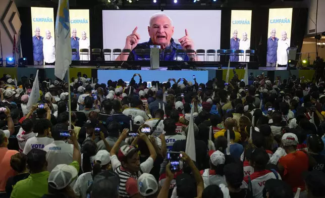 FILE - Former President Ricardo Martinelli sends a video message from inside the Nicaraguan embassy to supporters, during a campaign rally for presidential frontrunner Jose Raul Mulino, in Panama City, April 28, 2024. Martinelli has been campaigning for his former running mate from inside the walls of Nicaragua’s embassy, where he took refuge in February after receiving political asylum. (AP Photo/Matias Delacroix, File)
